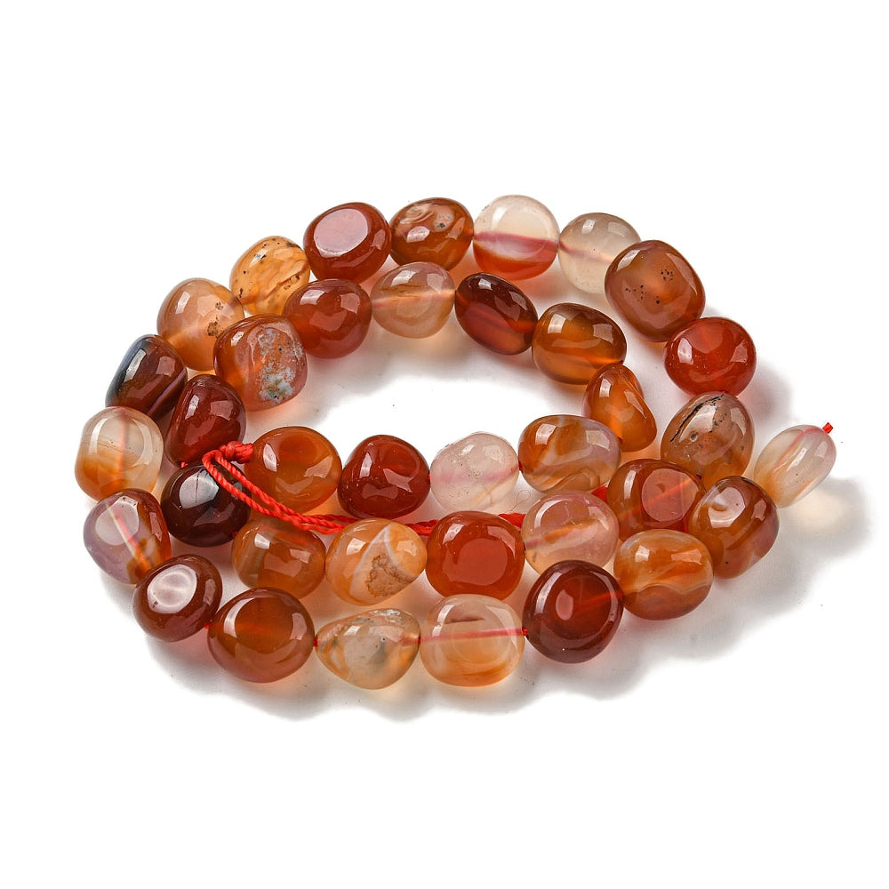 Translucent agate nugget beads strand with red string, mixed orange and red tones