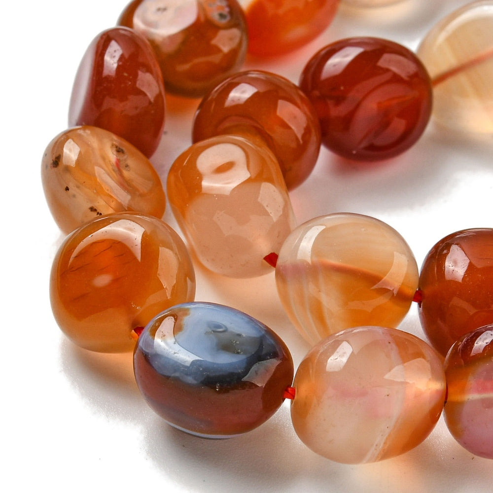 Orange and red agate nugget beads with glossy translucent ovals, red string detail