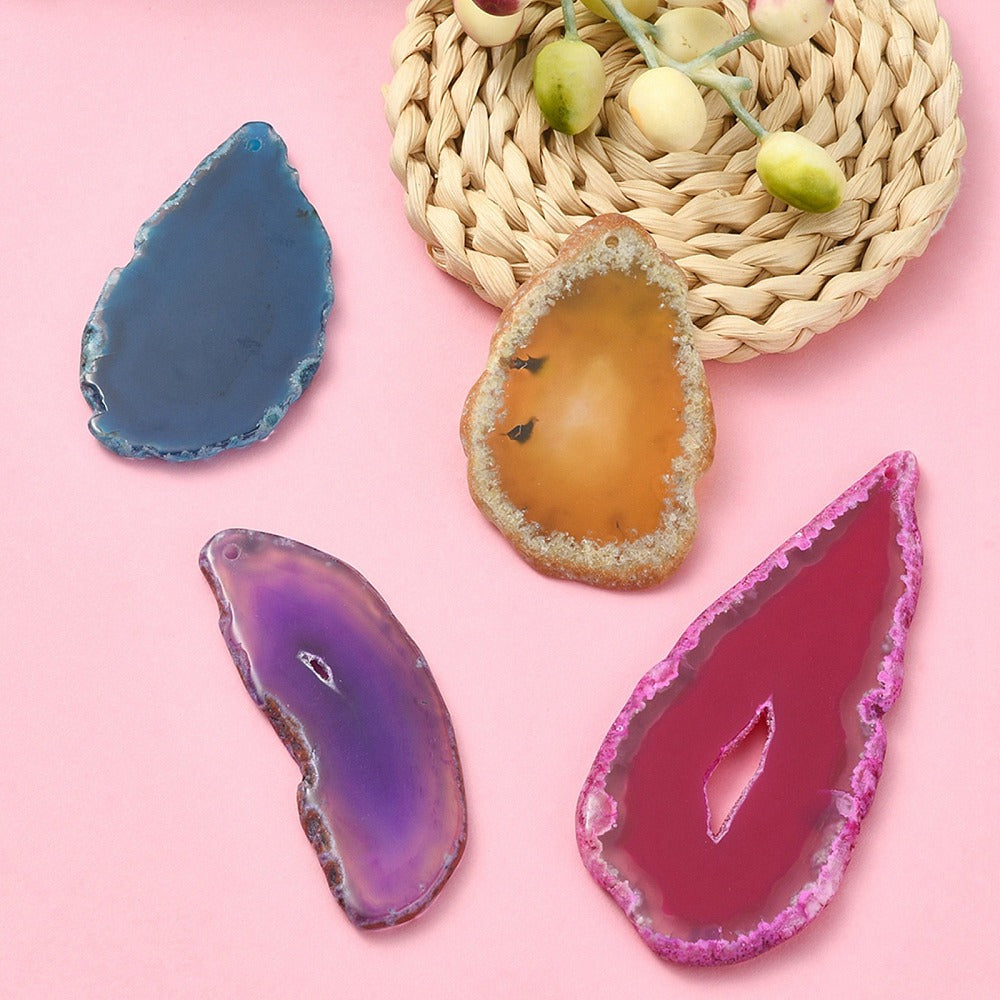 Agate pendant slices in blue, purple, yellow and magenta with drilled holes