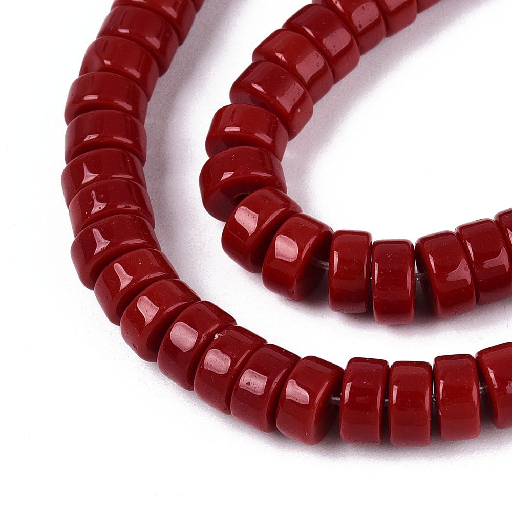 FireBrick red opaque flat round glass beads strand, close-up bead ends