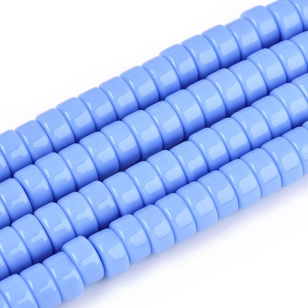 Cornflower blue flat round glass beads strand, close-up of smooth discs