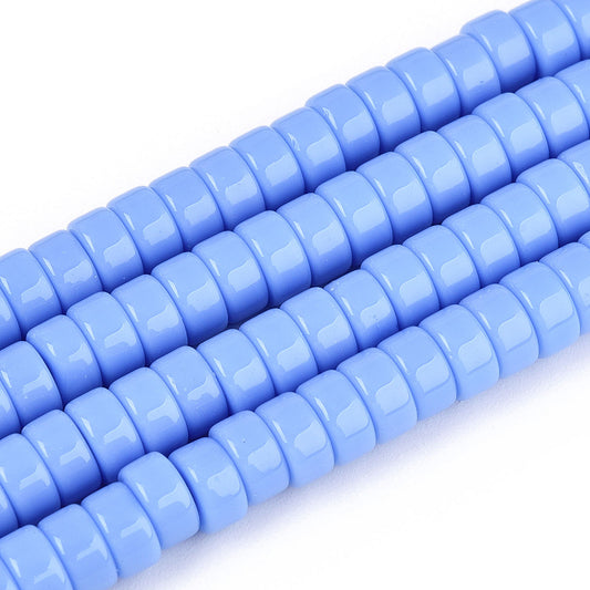 Cornflower blue flat round glass beads strand, close-up of smooth discs
