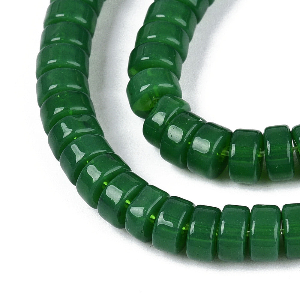 Green round bead strand with curved drape, glossy beads, individual close view