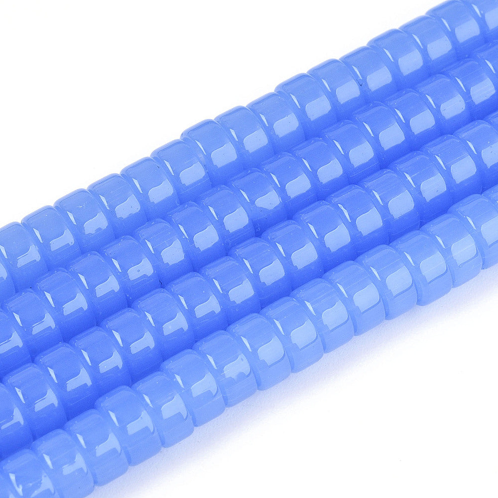 Cornflower blue flat round glass beads strand, close-up of central holes