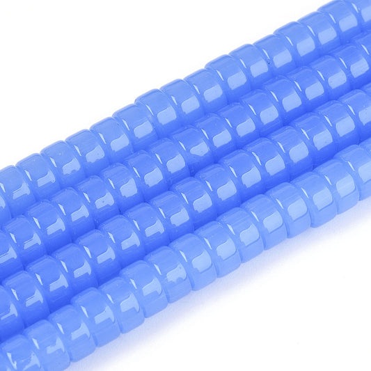 Cornflower blue flat round glass beads strand, close-up of central holes