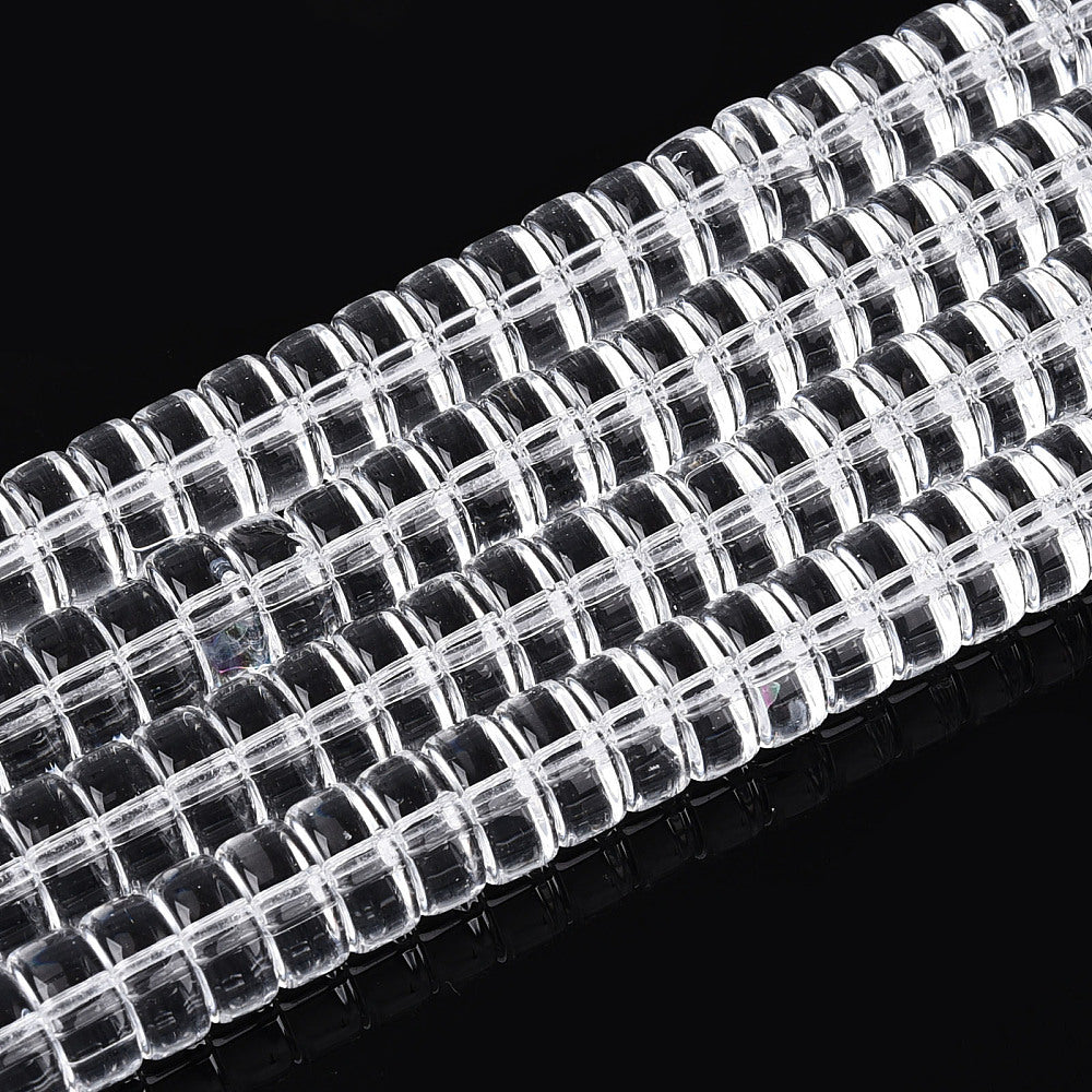 Clear flat round glass beads strand with square cut holes, close-up