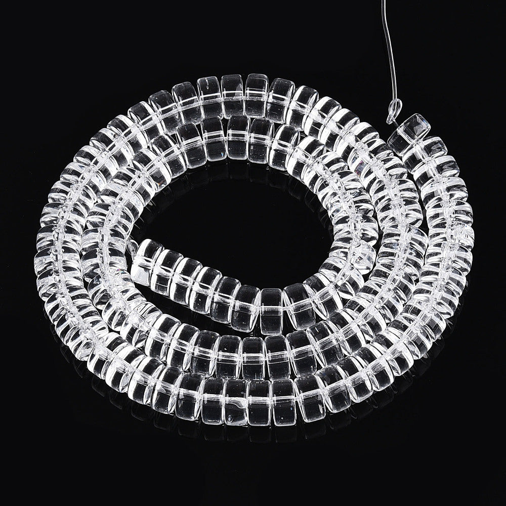 Clear flat round glass bead strand, coiled with visible square holes