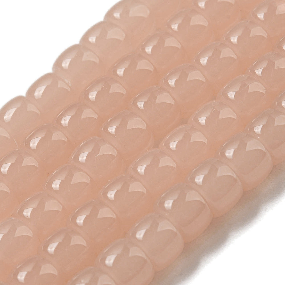 Salmon pink barrel glass beads strand, faceted oval barrel beads close-up