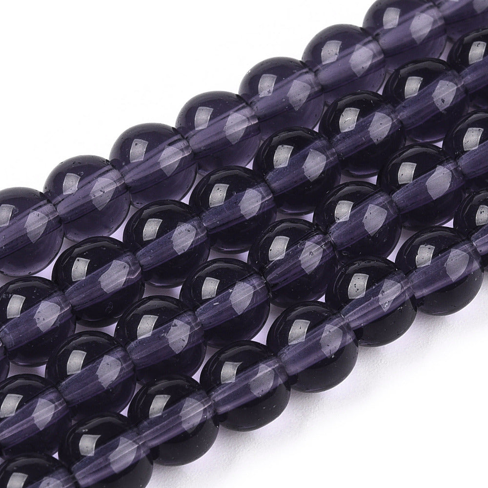 Dark purple transparent glass round beads, glossy finish and faceted highlights