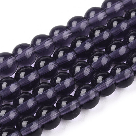 Dark purple transparent glass round beads, glossy finish and faceted highlights
