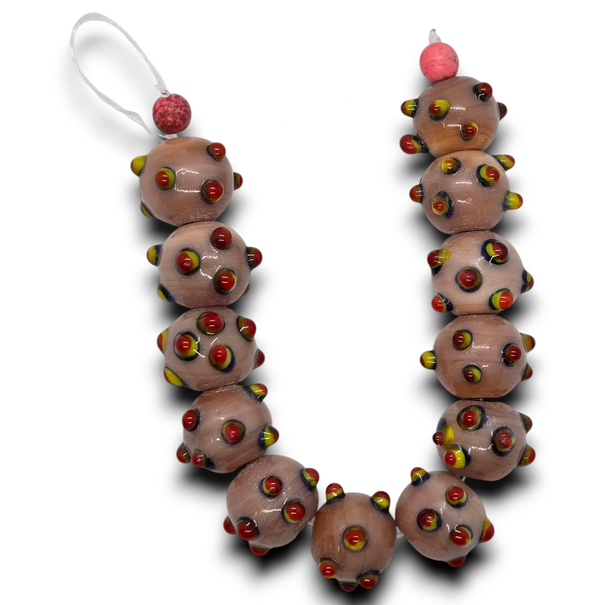 Vintage glass rondelle bead strand, dark pale peach with raised dots and colorful accents