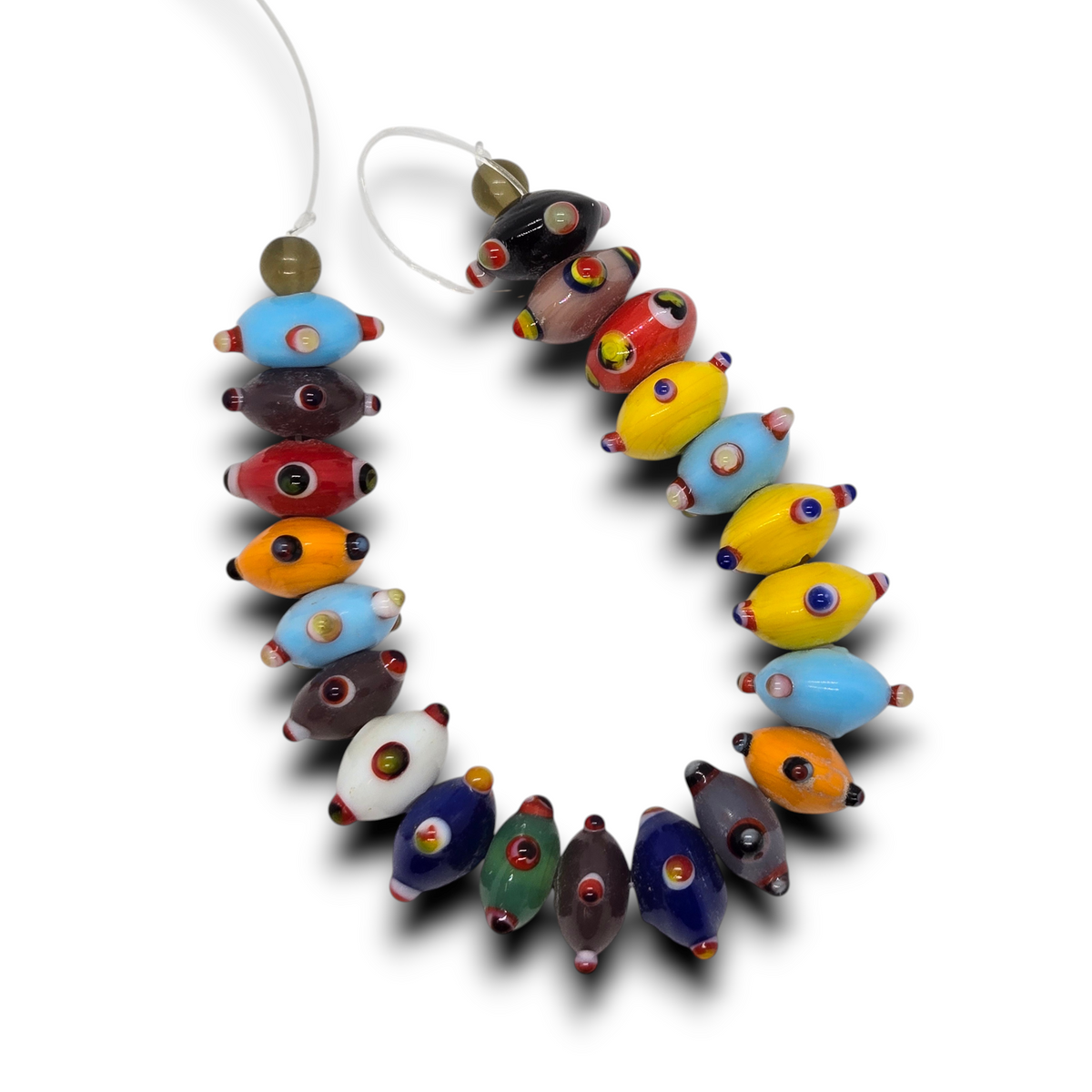 Multi-color glass rondelle beads with raised dots, strung on a strand