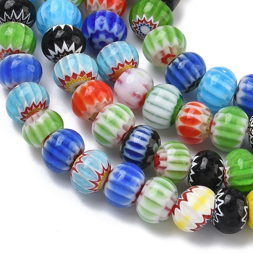 Close-up of mixed-color handmade glass rondelle beads with millefiori patterns