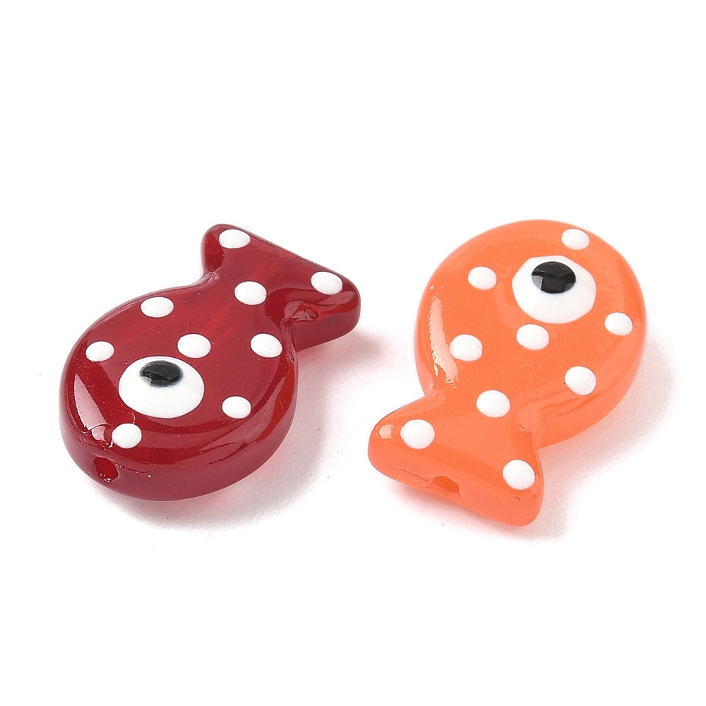 Fish-shaped glass enamel bead pair: red and orange with white dots and black eyes