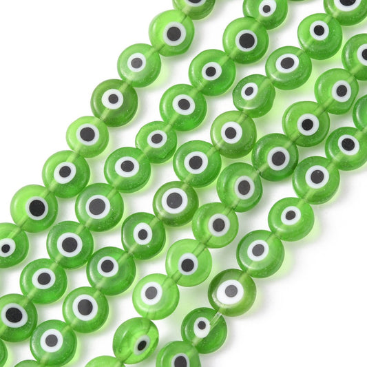 Lime green flat round lampwork beads on a strand, with white and black evil-eye centers
