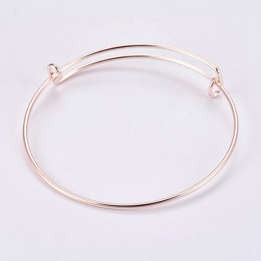 Rose gold alloy bangle bracelet, 65mm, open ends with clasp details
