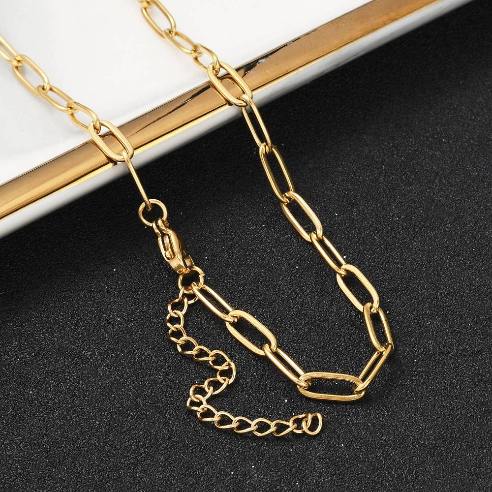Gold paperclip link chain necklace with connected clasp detail