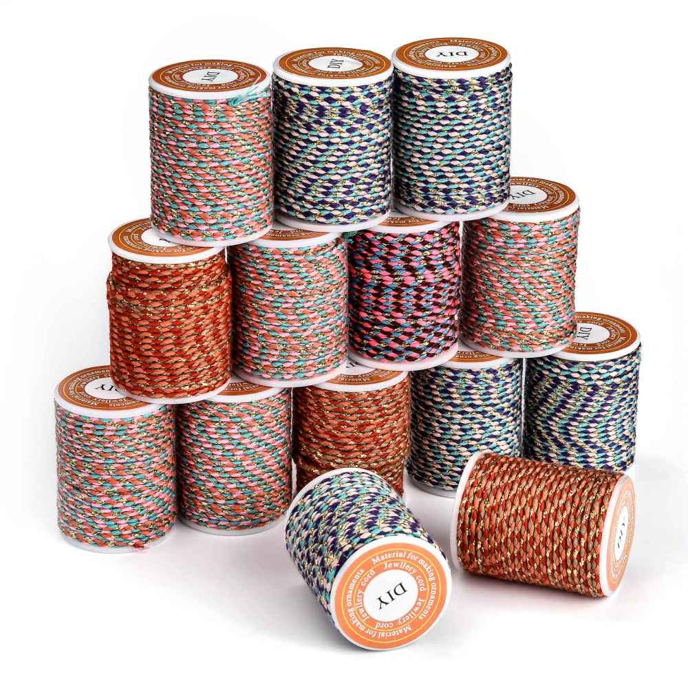 Metallic braided cord rolls with multicolor strands, teal, purple, and gold flecks