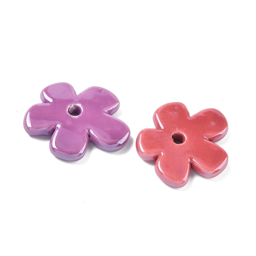 Porcelain flower beads in purple and coral pink, round center hole.