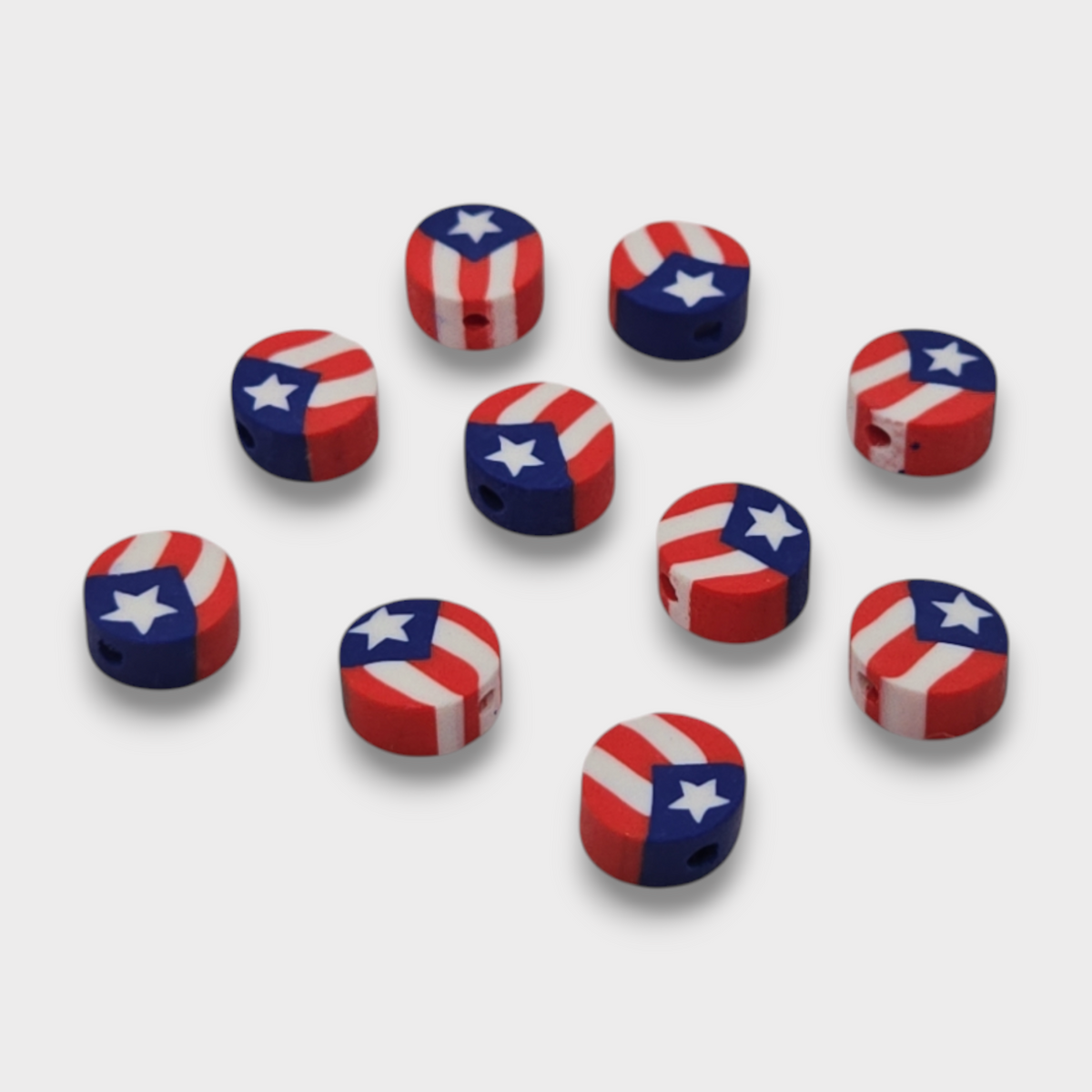Round clay beads with Puerto Rico flag design, red white blue star; arranged set