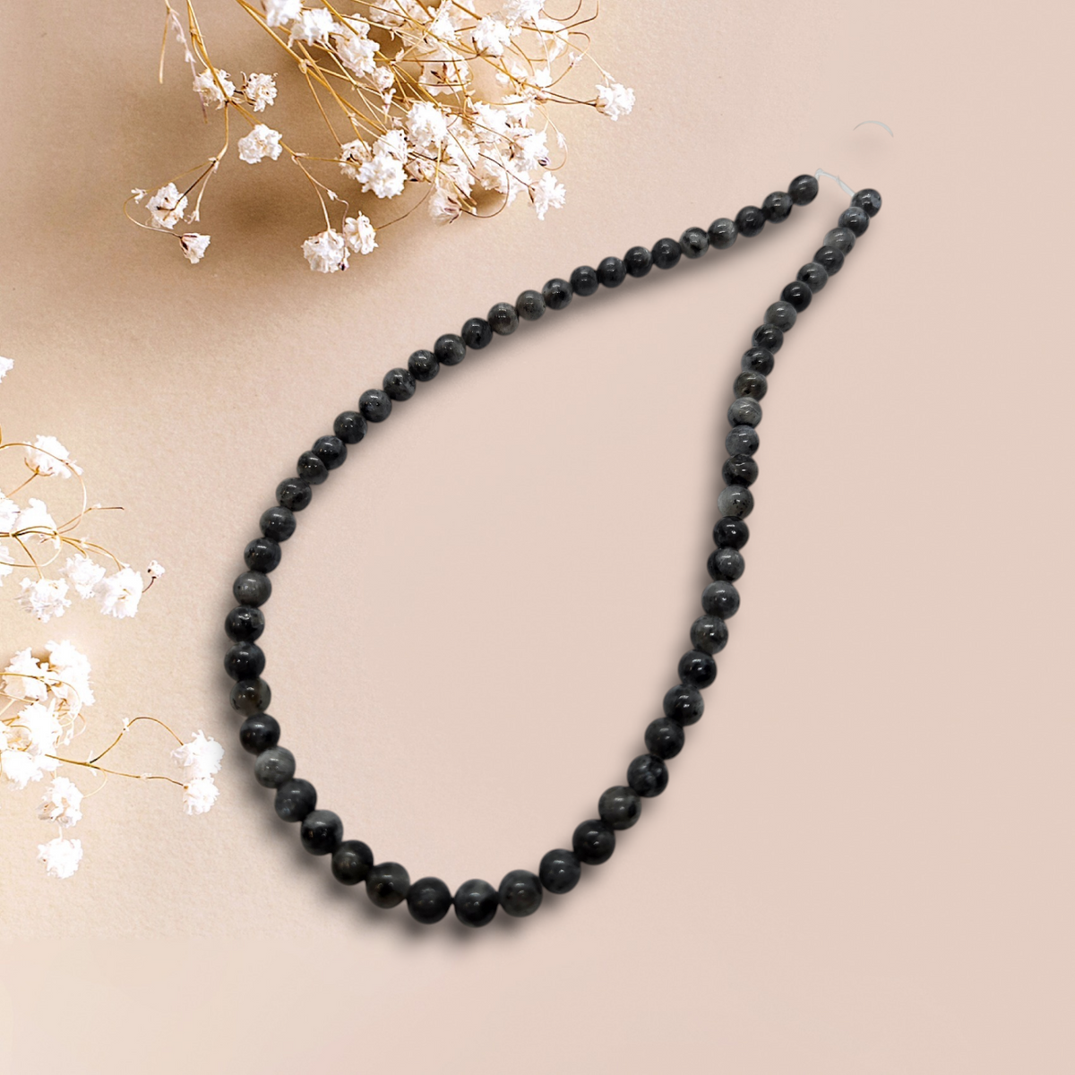 Larvikite bead necklace of 4mm round dark beads, strung in a V shape