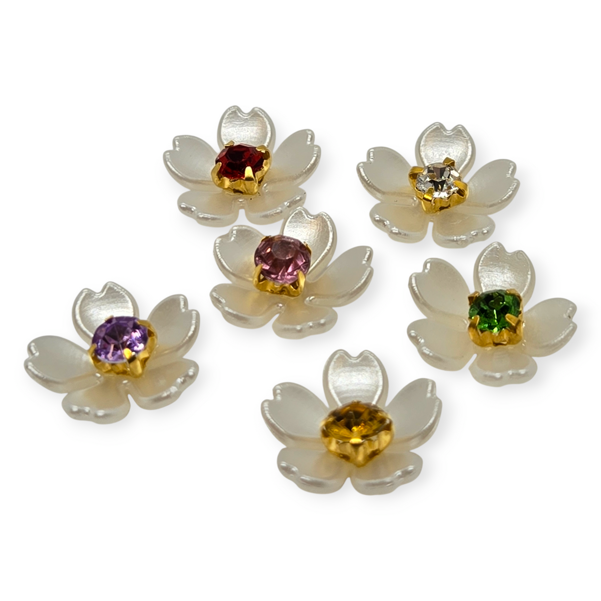 Acrylic flower beads with translucent white petals and gold, pink, and amber centers