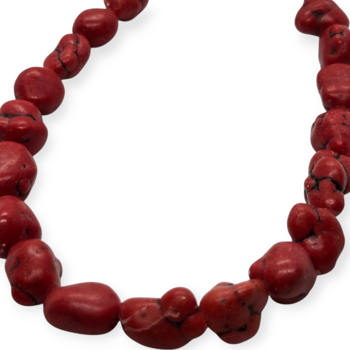 Red magnesite nugget beads close-up, irregular shapes with drilled holes