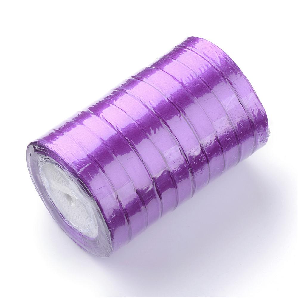 Purple satin ribbon roll on cardboard core