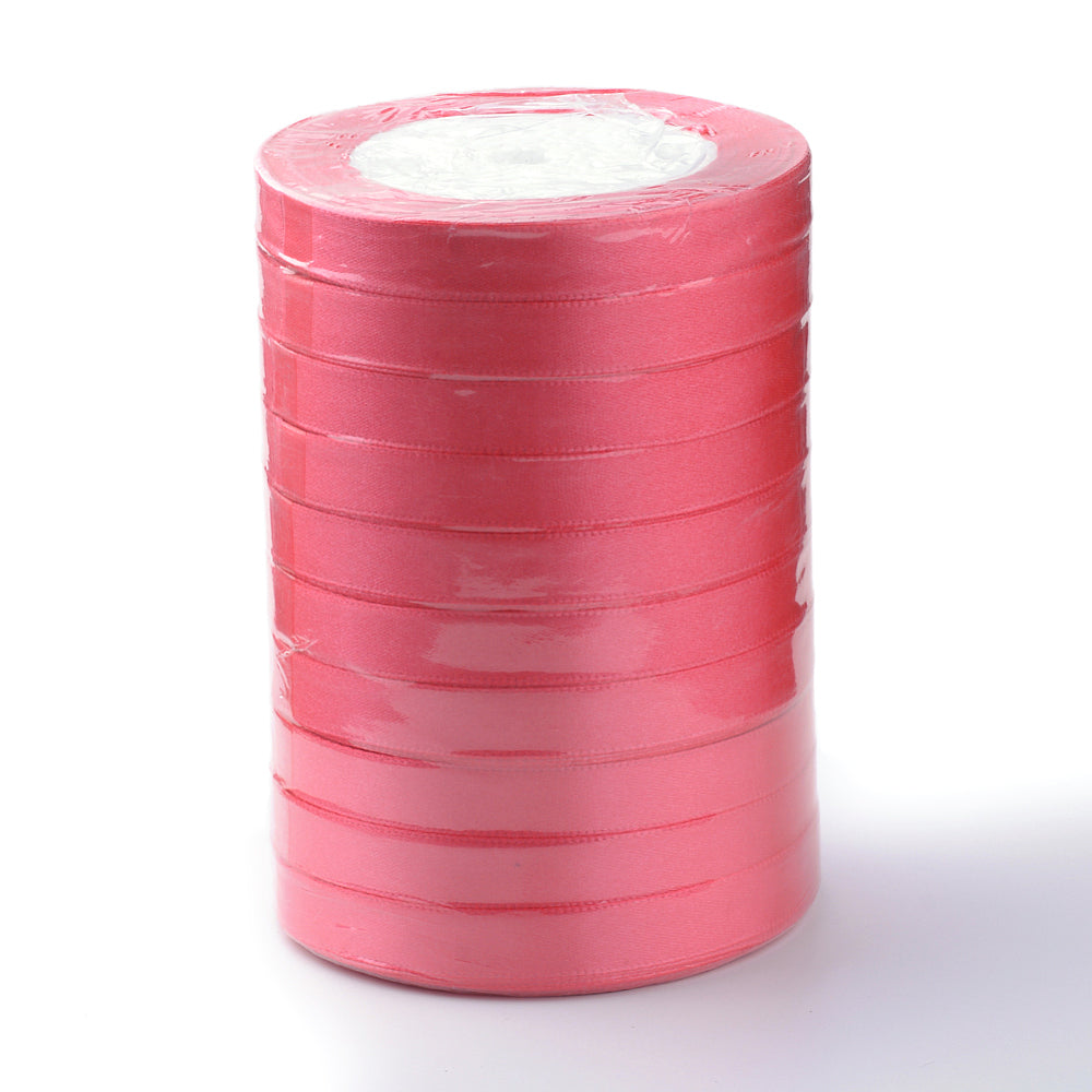 Cerise satin ribbon roll with tight horizontal winding, polyester ribbon