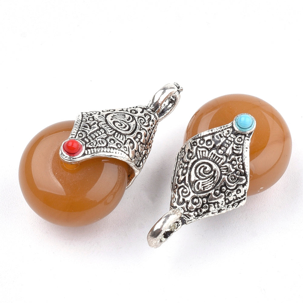 Antique silver teardrop pendant with amber resin and turquoise and red enamel details