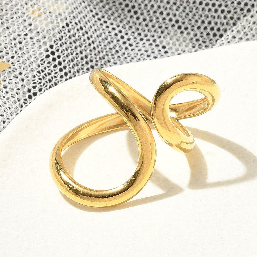 Gold-plated open cuff ring, side view of two interlocking bands