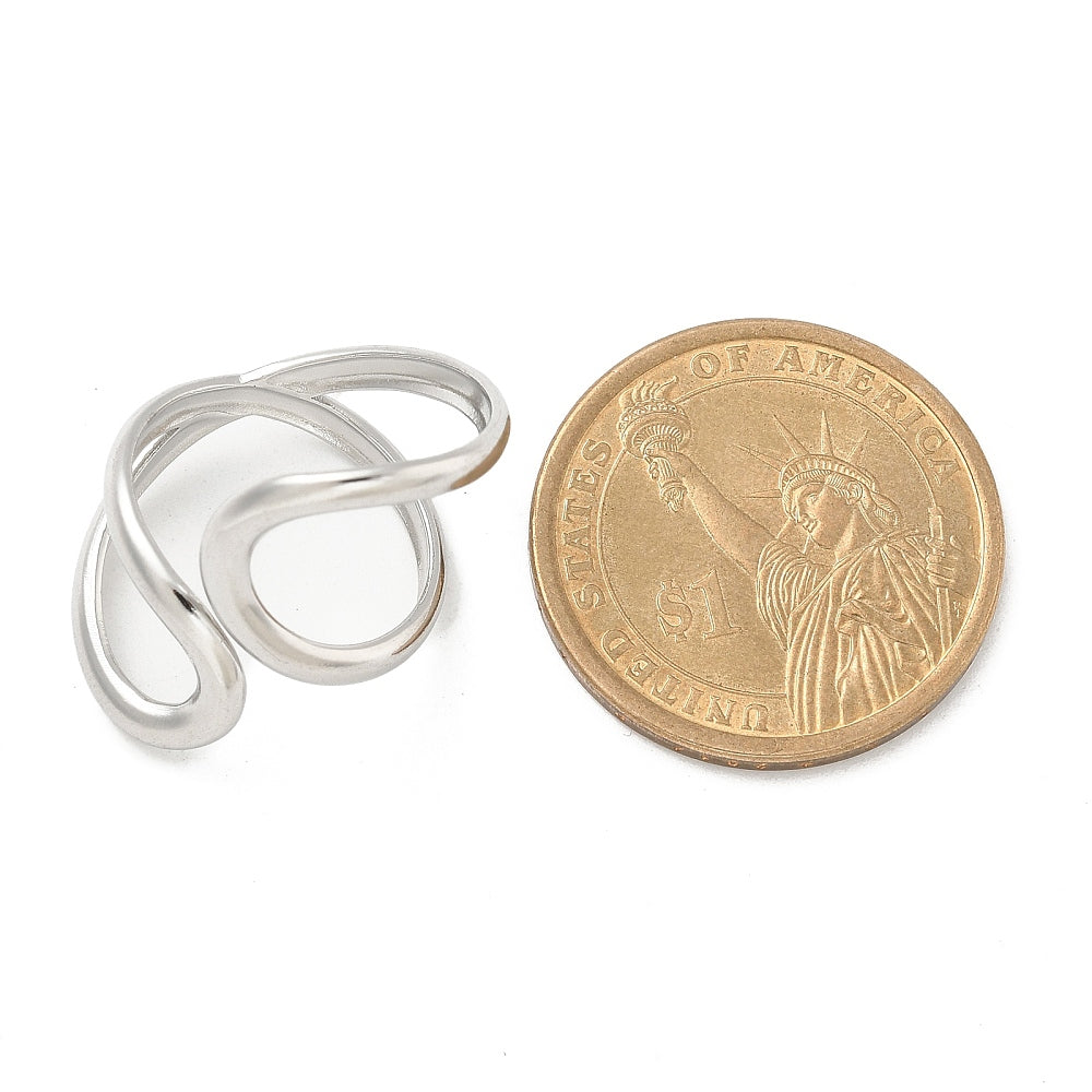 Stainless steel open cuff ring, silver tone, next to coin for scale