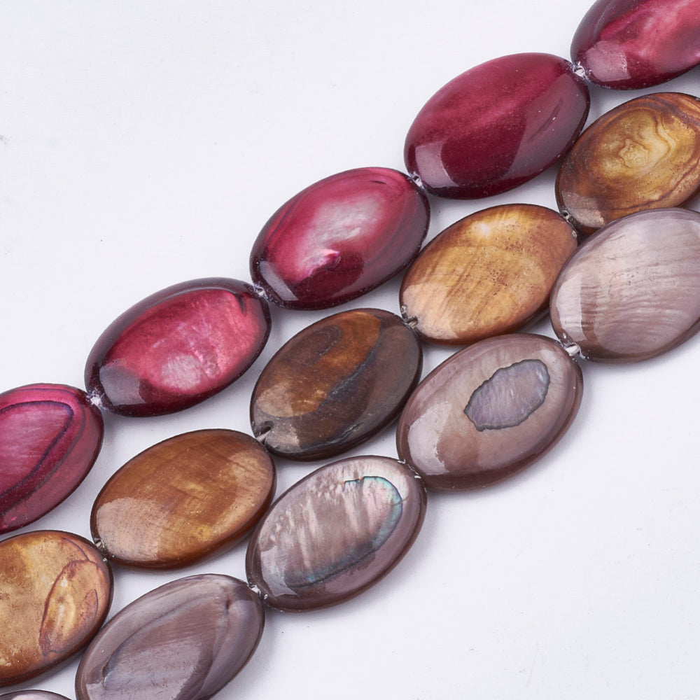 Dyed oval shell beads strand in rosy brown and mauve, glossy, assorted beads