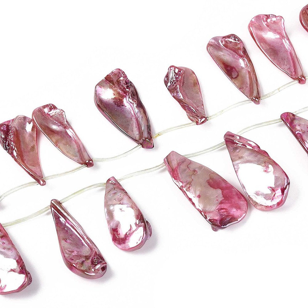 Cerise teardrop shell bead strand on wire, glossy translucent pieces with swirled patterns