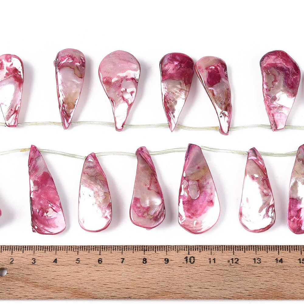 Cerise teardrop shell bead strand on wire with size ruler for length reference