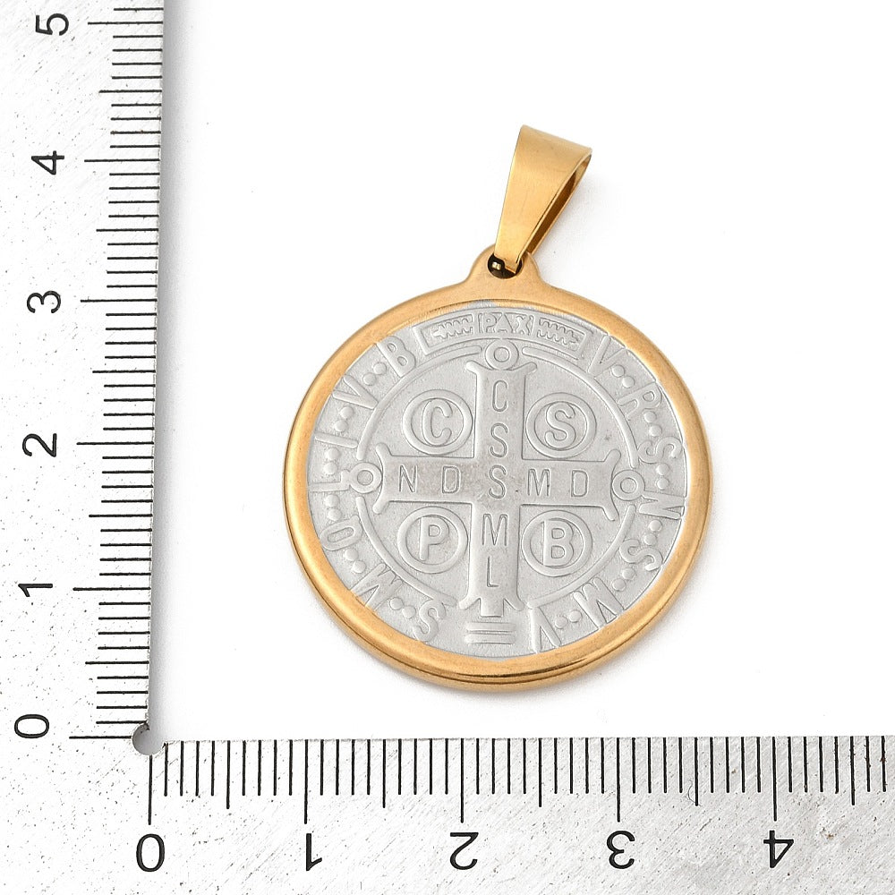 Saint Benedict medal pendant, gold-edged silver face with bail, shown on ruler for scale