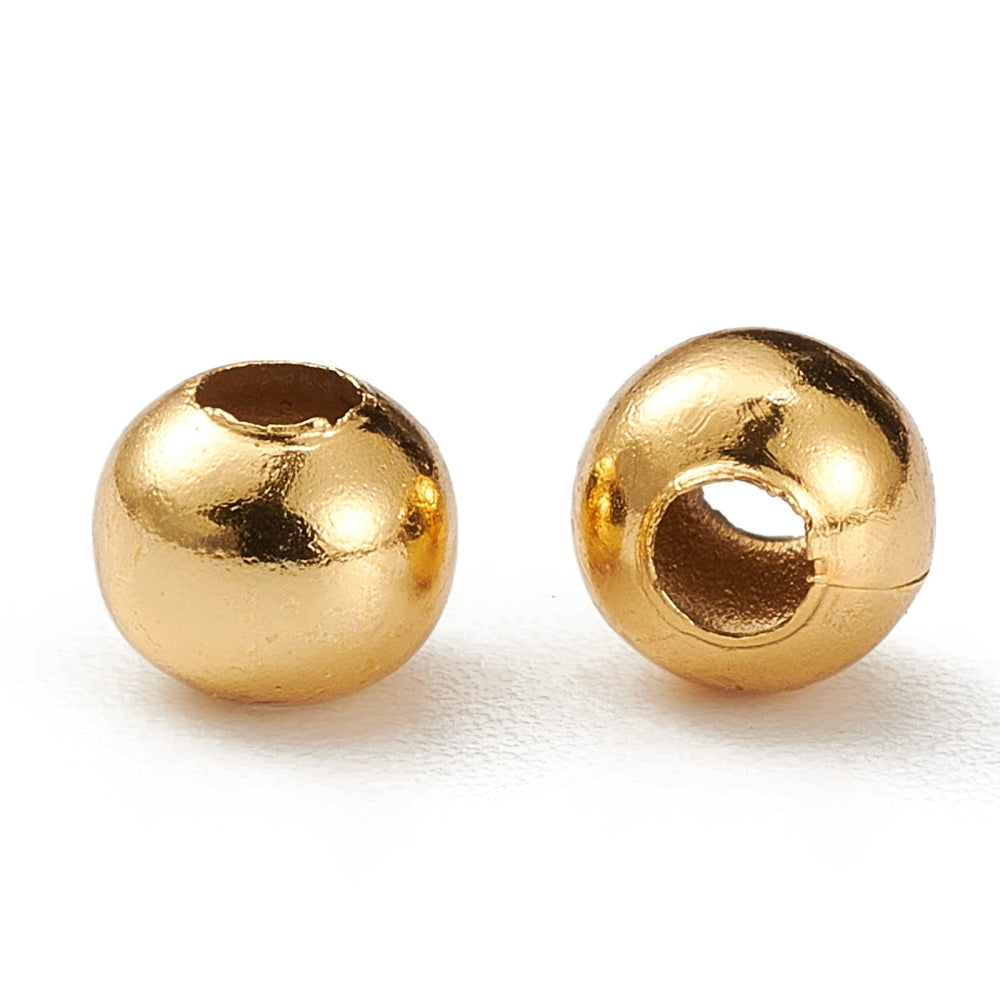 Round gold-plated beads with drilled center hole, two beads shown