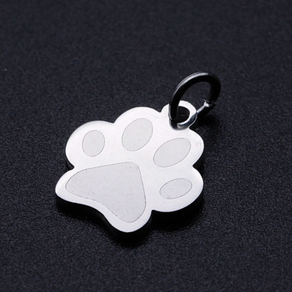 Stainless steel dog paw print charm with jump ring, front view, silver tone