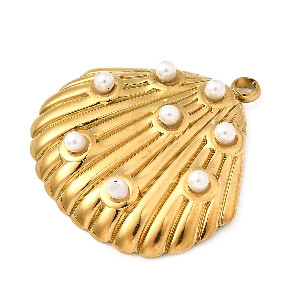 Gold shell pendant with pearl-studded ridges and side loop bail