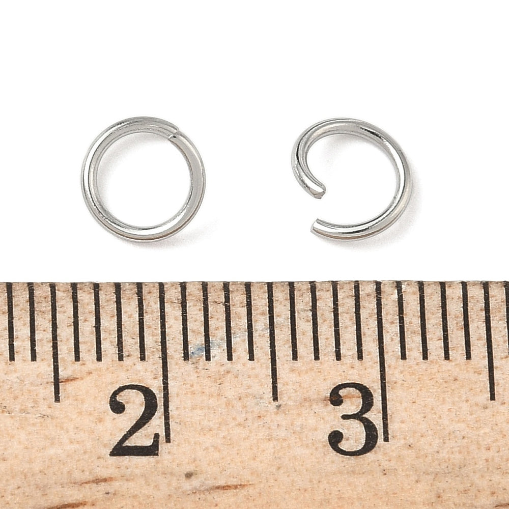 Stainless steel open jump rings with measuring scale for size comparison