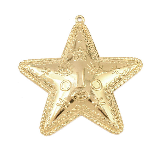 Gold-plated star pendant with abstract face and top loop; textured etched front.