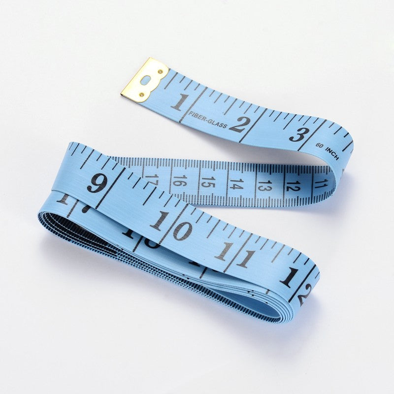 Blue retractable tape measure with inch scale on flexible tape