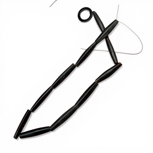 Black horn tube bead strand with cylindrical beads and center holes