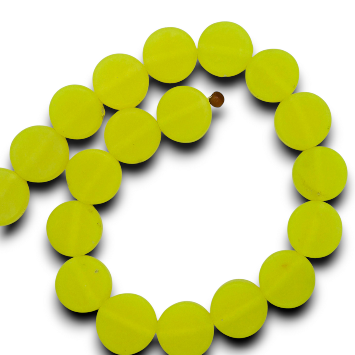 Neon yellow flat rondel resin beads strand forming a circle of round disc beads