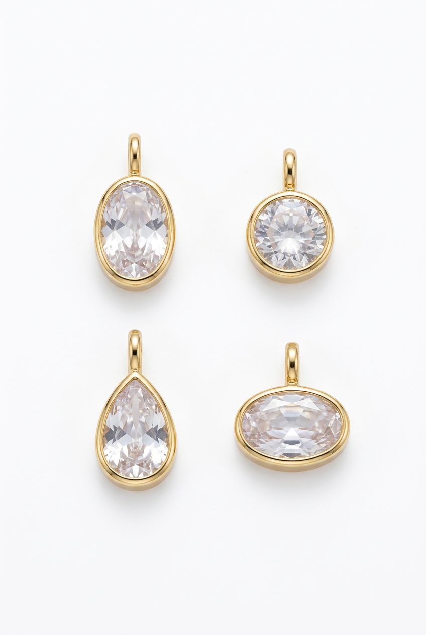 Gold-tone clear zircon pendant set, four assorted shapes: oval, round, teardrop, heart