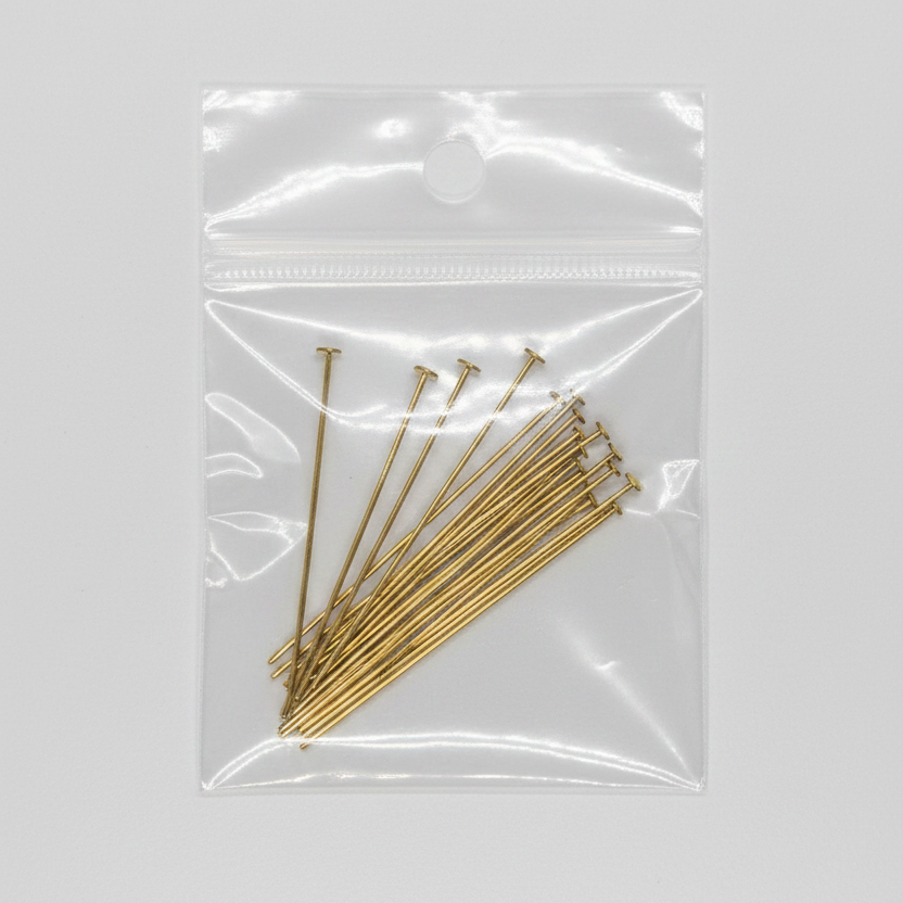 Gold flat head pins, metal jewelry findings, in clear plastic bag