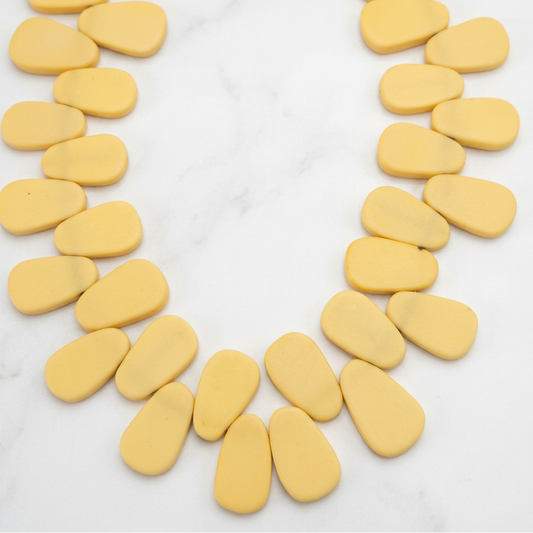 Yellow flat teardrop resin beads strand, oval drop-shaped beads