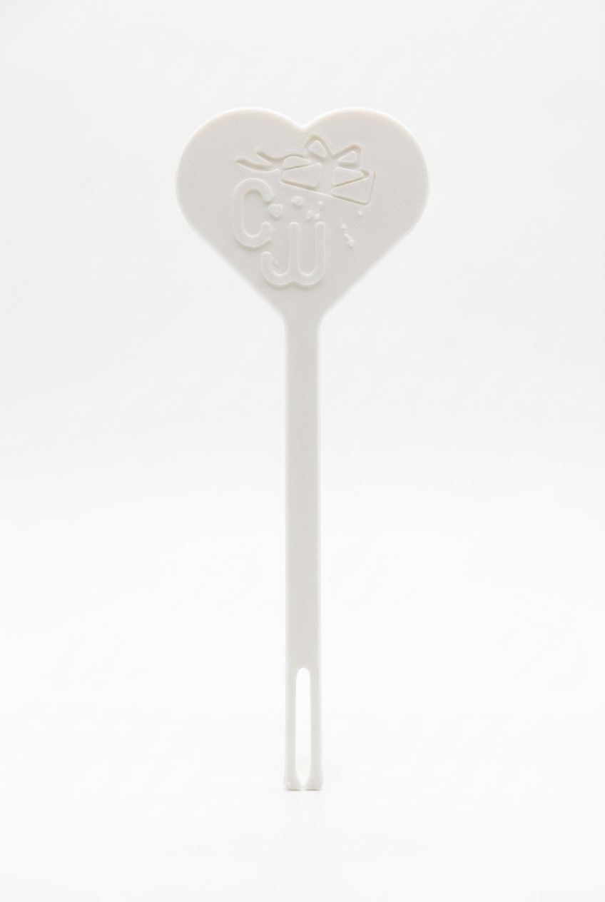 White paracord threader with heart-shaped handle and embossed cord opening