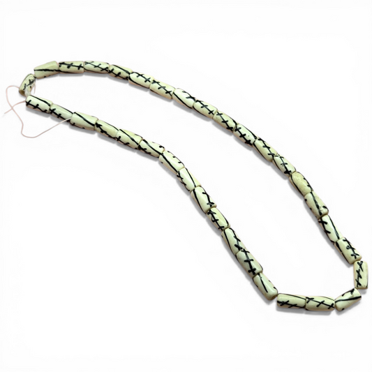 Vintage bone tube bead strand with black crossing lines pattern, 12x5mm.