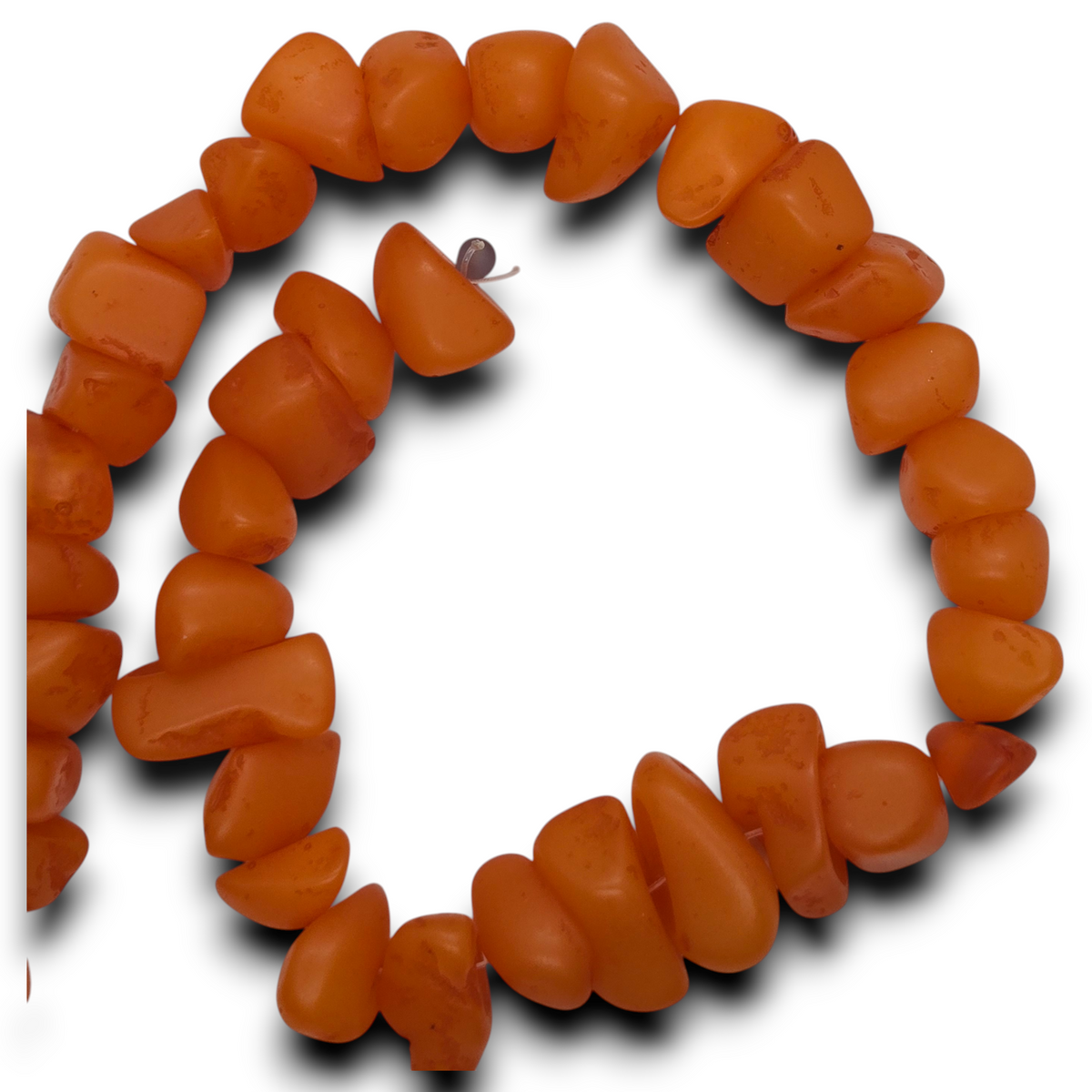 Orange resin chip bead strand with irregular chips, shown in a loop.